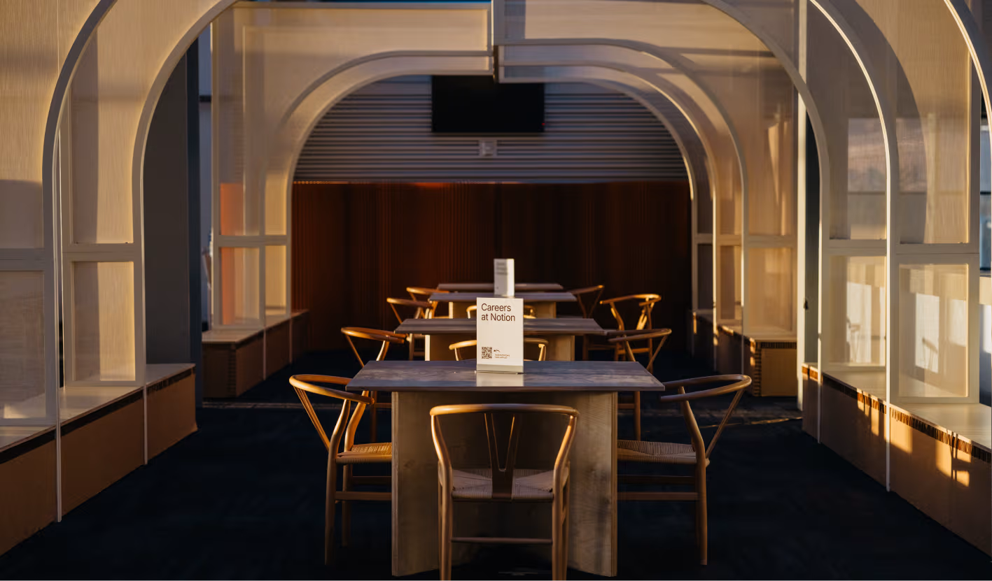 The soft morning light filtering through the suspended translucent fabric scrims.